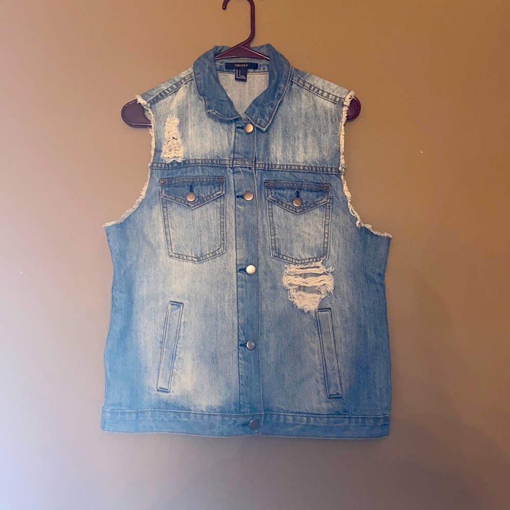 Women’s size large Jean jacket vest with rips in front and back